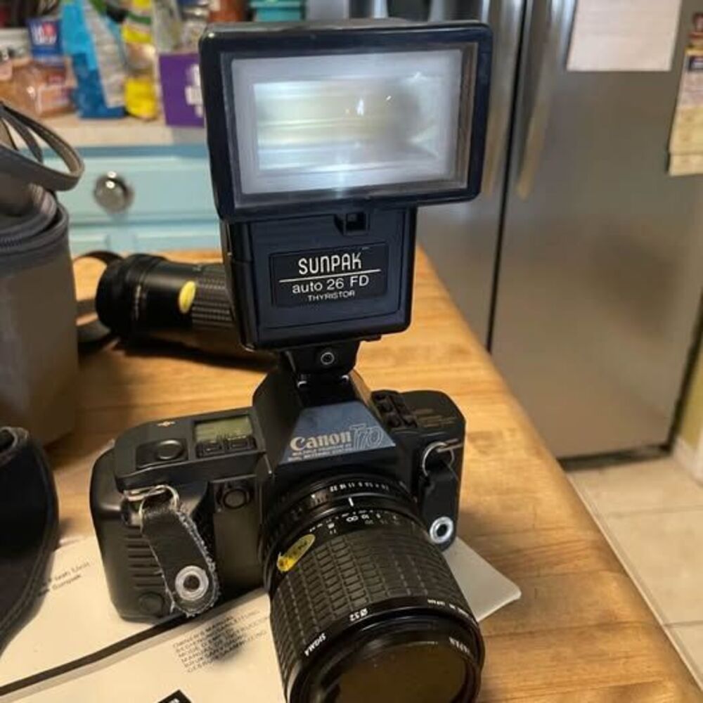 Canon T70 Film Camera Bundle with Sunpak Flash and Lenses